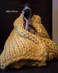 Yellow chunky knitted blanket
